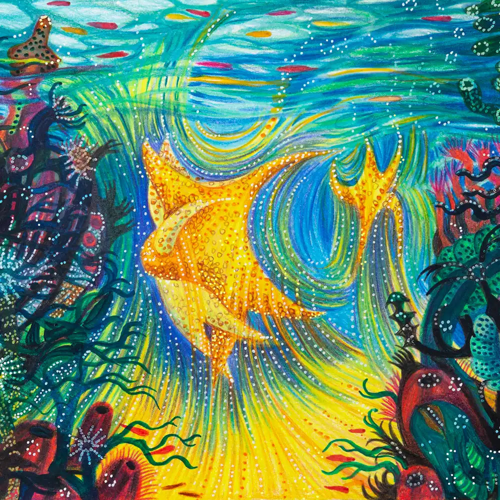 Vibrant yellow starfish swimming underwater.